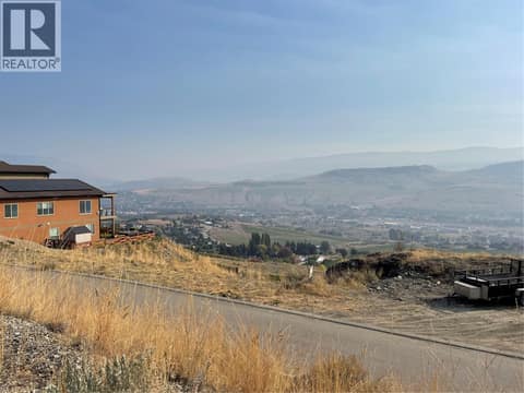View from the road above your property at 595 Vineyard Way N Unit# 33, Bella Vista, Vernon
