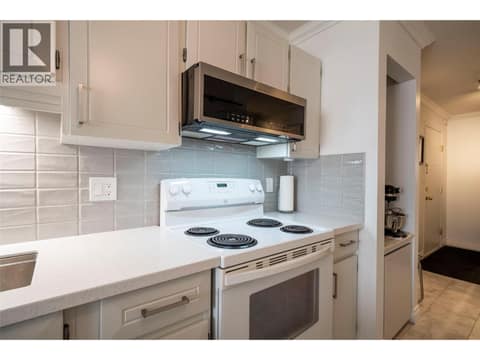 Kitchen, newer low profile microwave at 3608 27 Avenue Unit# 209, City of Vernon