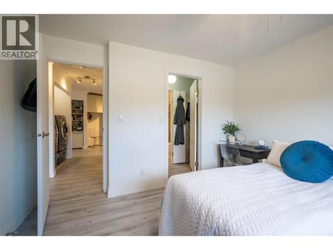 Primary bedroom with access to bathroom at 3608 27 Avenue Unit# 209, City of Vernon