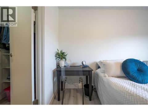Primary bedroom with access to bathroom at 3608 27 Avenue Unit# 209, City of Vernon