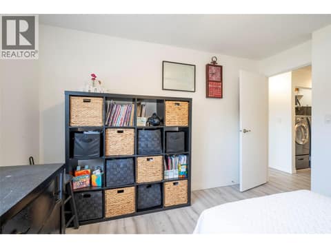 Primary bedroom with access to bathroom at 3608 27 Avenue Unit# 209, City of Vernon