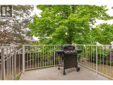 Back deck with access to grassy area at 133 Wyndham Crescent Unit# 110, North Glenmore, Kelowna