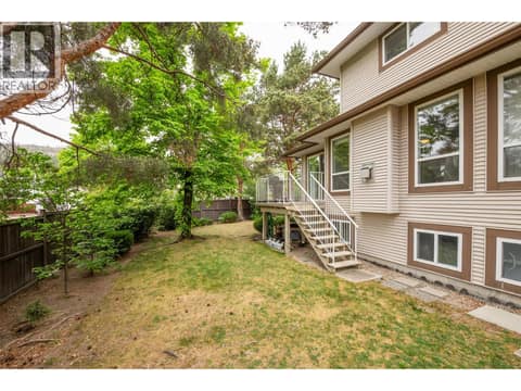 Desirable end unit featuring a back deck with access to green space. at 133 Wyndham Crescent Unit# 110, North Glenmore, Kelowna