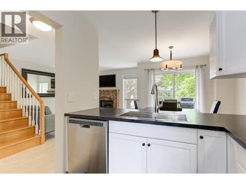 Kitchen to dining and living room at 133 Wyndham Crescent Unit# 110, North Glenmore, Kelowna
