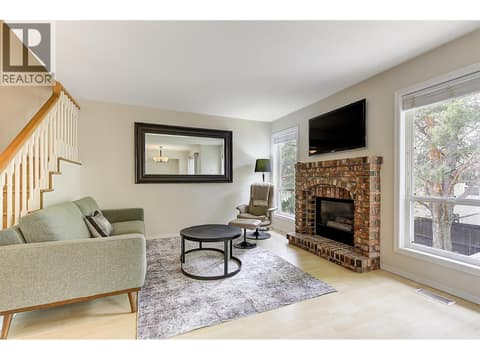 Living room with gas fireplace at 133 Wyndham Crescent Unit# 110, North Glenmore, Kelowna