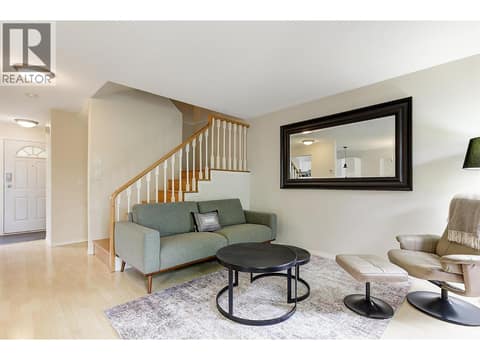 Living room with gas fireplace at 133 Wyndham Crescent Unit# 110, North Glenmore, Kelowna