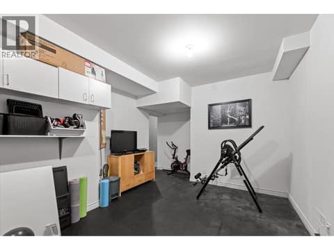 Fitness room downstairs connected to main home great for a home studio or gamers space. at 4187 Gallaghers Crescent, South East Kelowna