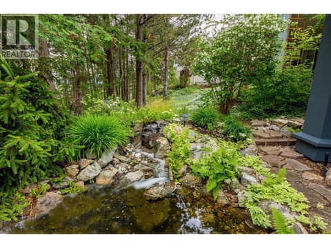 Lush and tranquil backyard with fish pond at 4187 Gallaghers Crescent, South East Kelowna
