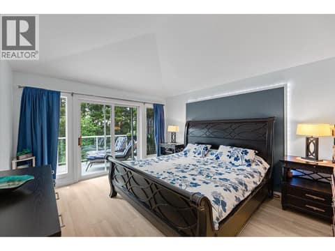 Primary bedroom with large walk in closet at 4187 Gallaghers Crescent, South East Kelowna