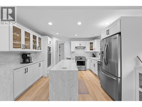 Quartz backsplash and waterfall edge at 4187 Gallaghers Crescent, South East Kelowna