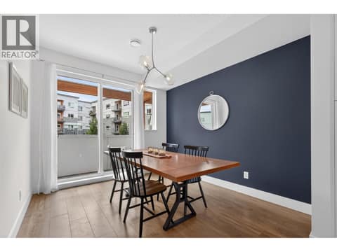 Oversized dining area with a balcony, allowing fresh air and natural light to flow through the heart of the home. at 720 Valley Road Unit# 28, North Glenmore, Kelowna