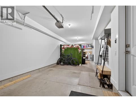 Oversized tandem garage offering plenty of room for vehicles, storage, bikes, outdoor gear, or future flex space such as a home gym or office. at 720 Valley Road Unit# 28, North Glenmore, Kelowna