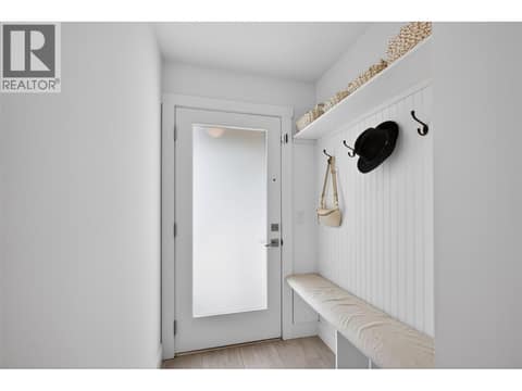 Welcoming front foyer with a built-in bench and dedicated storage space for coats, shoes, and everyday essentials. at 720 Valley Road Unit# 28, North Glenmore, Kelowna