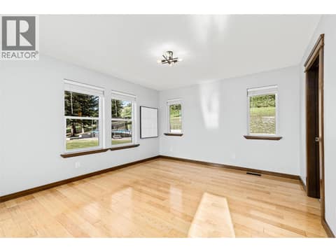 Primary Bedroom | Main Level - With 5 piece ensuite, walk-in closet & direct access to the walk-out patio at 17936 Angus Road, Lake Country North West