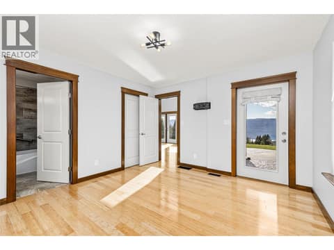 Primary Bedroom | Main Level oom | Main Level - With 5 piece ensuite, walk-in closet & direct access to the walk-out patio at 17936 Angus Road, Lake Country North West