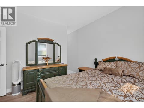 Main floor bedroom at 10818 Westshore Road, Okanagan North, Vernon