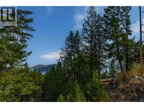 Small lakeview from the upper level deck at 10818 Westshore Road, Okanagan North, Vernon