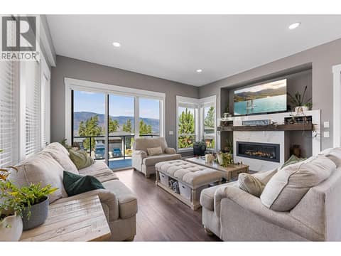 Living room with access to the deck at 8819 Heritage Drive, Lake Country South West