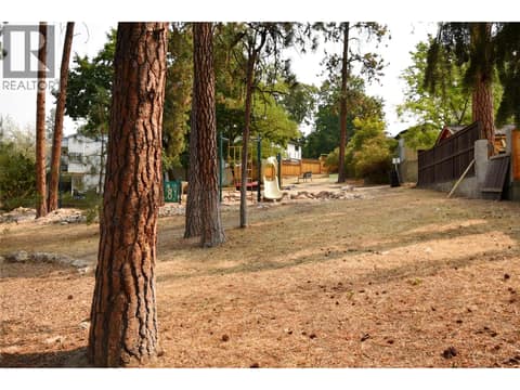 View of private playground accessed from gate in back yard at 3907 17 Street, East Hill, Vernon