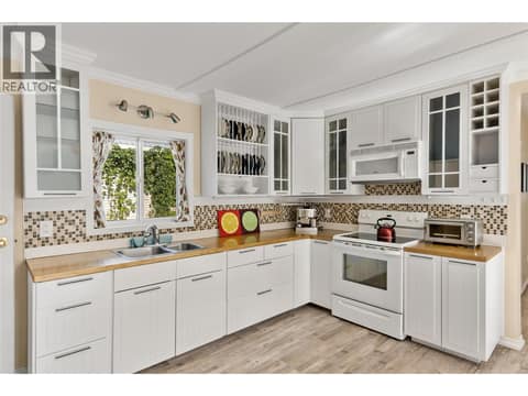 Kitchen with 4 entrances at 408 & 410 Mackenzie Avenue, Revelstoke