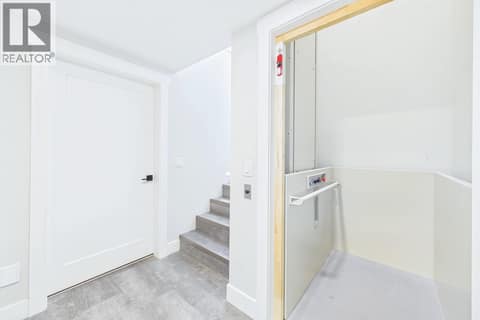 Elevator from Lower Level to Upper Level at 439 Redtail Court, Kettle Valley, Kelowna