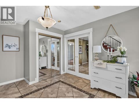 French doors into family room at 2848 Inverness Road, Glenrosa, West Kelowna