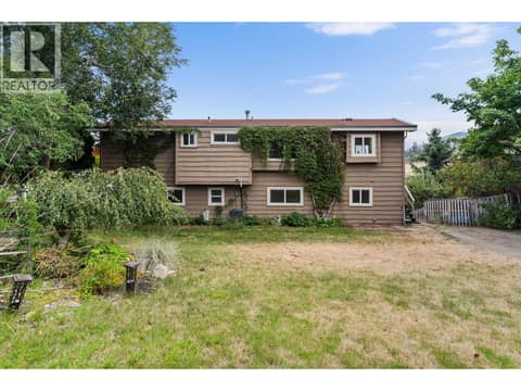 Picture a pool, playground or garden in this large backyard at 2848 Inverness Road, Glenrosa, West Kelowna