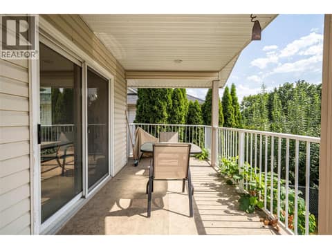 Balcony with lots of room for a bbq and seating at 5804 Richfield Drive, Westmount, Vernon