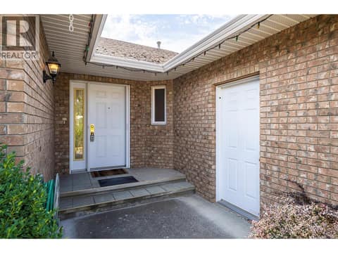Front entrance and garage entrance on right at 5804 Richfield Drive, Westmount, Vernon