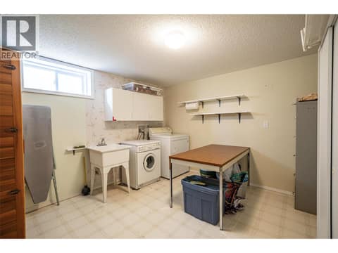 Laundry room on basement level at 5804 Richfield Drive, Westmount, Vernon