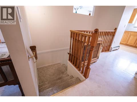 Stairs to basement level at 5804 Richfield Drive, Westmount, Vernon