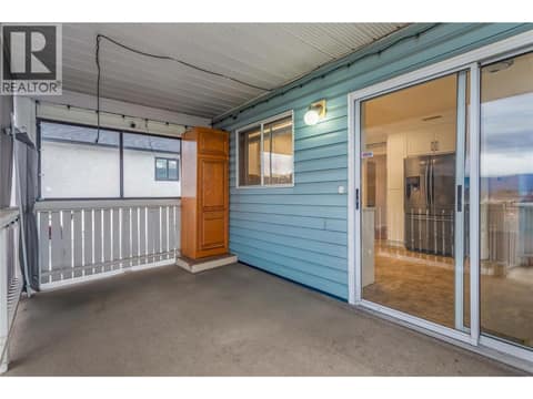 Back Deck, Covered with BBQ Gas Hookup and Stairs going down to Backyard. at 1730 Simpson Court, Rutland South, Kelowna