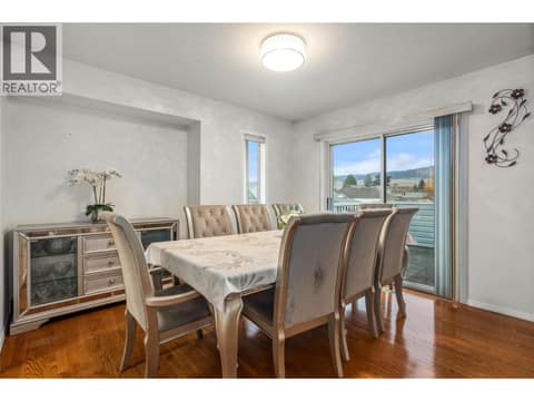 Dining Room leading to Outdoor Deck at 1730 Simpson Court, Rutland South, Kelowna