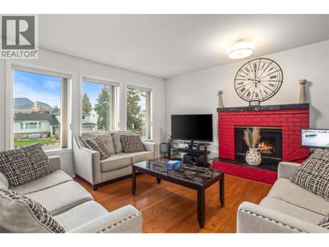Living Room with Gas Fireplace at 1730 Simpson Court, Rutland South, Kelowna