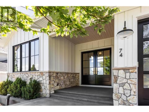 Beautiful front entry double wooden doors at 74 Red Sky Court, Wilden, Kelowna