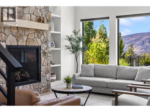 Cozy great roon with floor to ceiling stone fireplace at 74 Red Sky Court, Wilden, Kelowna