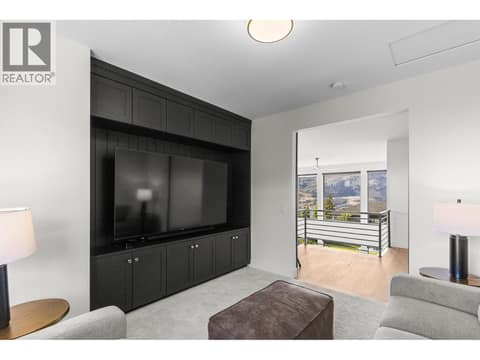 More family theatre room with beautiful built-ins at 74 Red Sky Court, Wilden, Kelowna