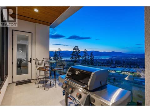 2nd main floor deck has stairs down to the backyard at 980 Ledgeview Court, Upper Mission, Kelowna