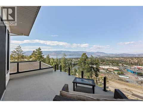 Access out to the upstairs balcony with massive views at 980 Ledgeview Court, Upper Mission, Kelowna