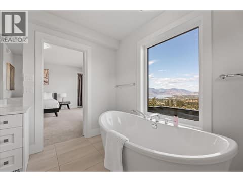 Beautiful framed soaker tub at 980 Ledgeview Court, Upper Mission, Kelowna