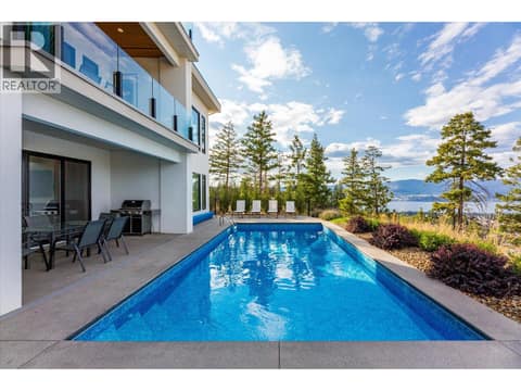 Pool deck with beautiful views at 980 Ledgeview Court, Upper Mission, Kelowna