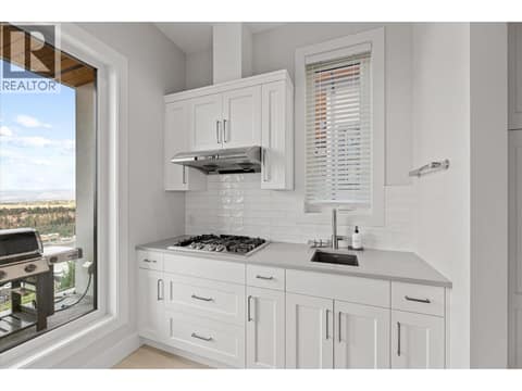 With access to main floor laundry room at 980 Ledgeview Court, Upper Mission, Kelowna