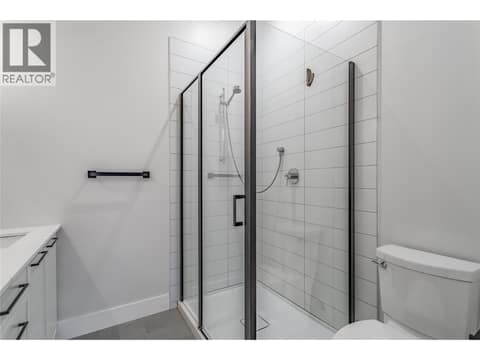 Tiled walk-in shower in the ensuite bathroom at 1220 Pacific Avenue Unit# 507, Springfield/Spall, Kelowna