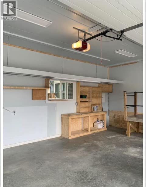 Lots of storage available in the double attached garage at 1835 Nancee Way Court Unit# 48, West Kelowna Estates