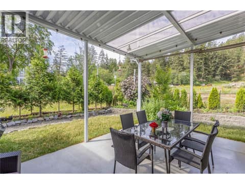 Private backyard, fully fenced and lined with cedars/trees at 1835 Nancee Way Court Unit# 48, West Kelowna Estates
