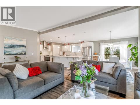 Vaulted ceilings and an open-concept main living area at 1835 Nancee Way Court Unit# 48, West Kelowna Estates