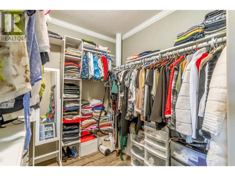 Walk-in closet in the primary bedroom at 1835 Nancee Way Court Unit# 48, West Kelowna Estates