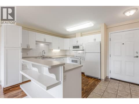 Island with storage shelves at 250 Dougall Road N Unit# 405, Rutland North, Kelowna