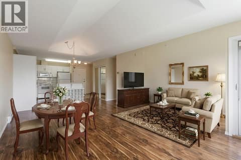 Virtually staged living and dining area at 250 Dougall Road N Unit# 405, Rutland North, Kelowna