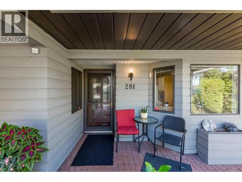Covered entrance and storage room in the front of the carport. at 1765 Leckie Road Unit# 201, Springfield/Spall, Kelowna